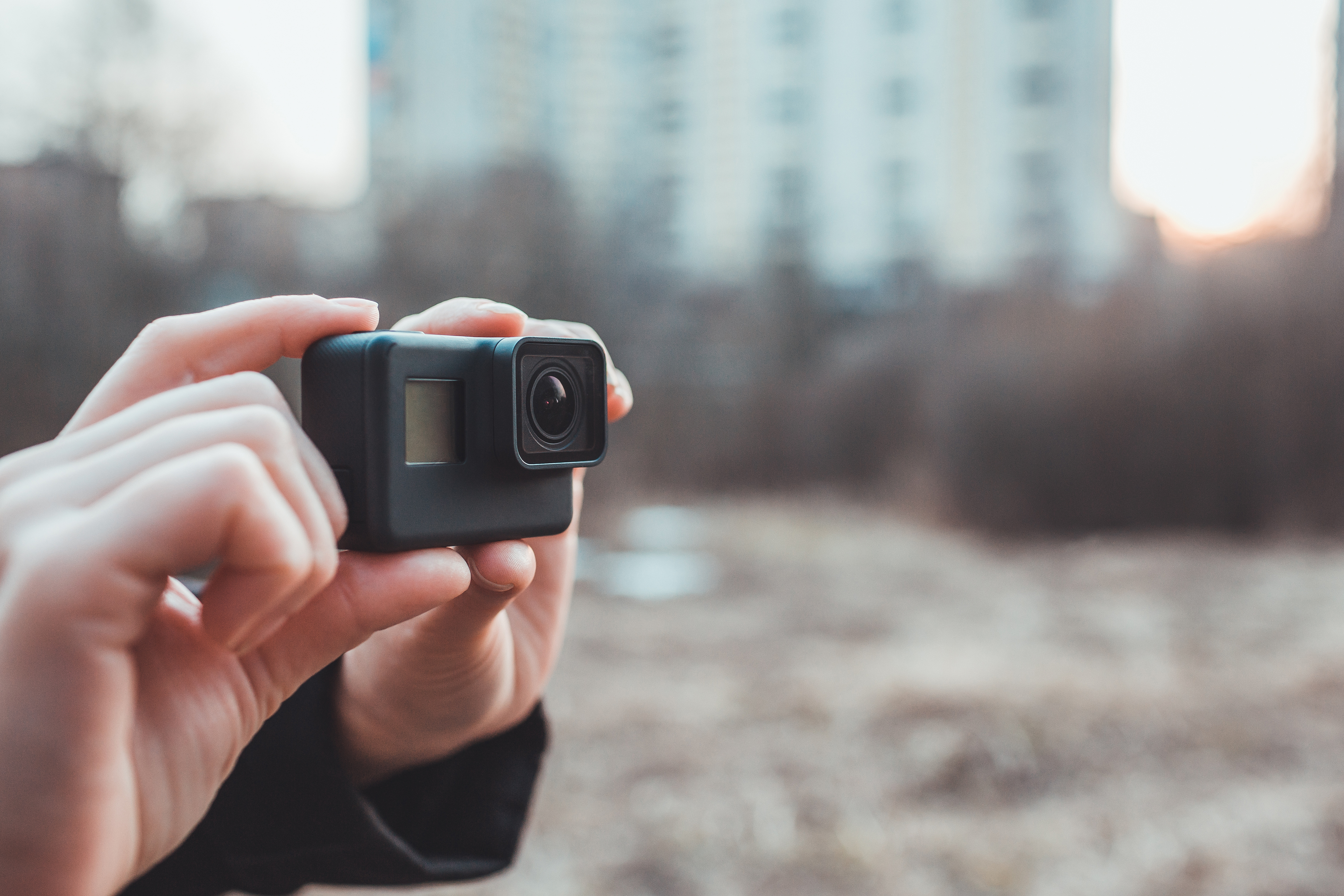 Holding GOPRO in hand.