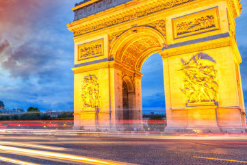 Triumph Arc in Paris with Etoile Roundabout traffic light trails.