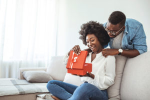 women opening a present